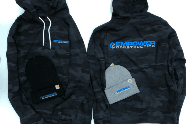 Empower Construction branded Carhartt beanies and multicam black hoodies